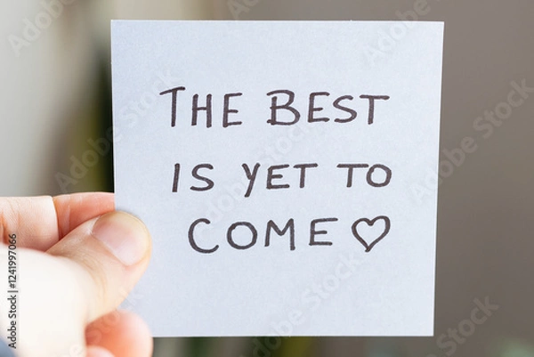 Fototapeta Sticky Notes with 'The Best is Yet to Come' on Colored Paper