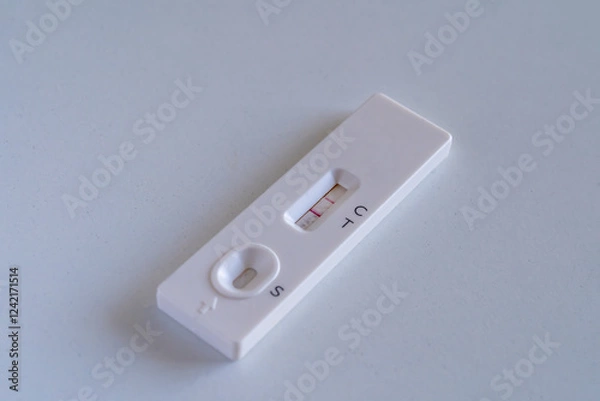 Obraz Positive Covid test close up on a white table