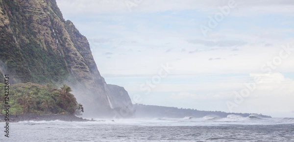 Obraz Epic cliffs of north Kohala Coast of Hawaii, a place where view ever visit. Waterfalls cascade 1000ft off the cliffs into the wild ocean waves below. Tropical green foliage clings to the cliffs.