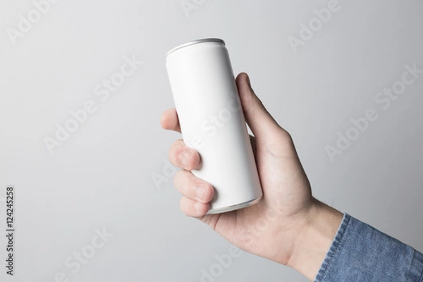 Fototapeta Blank Can in hand on white background, ready to replace your design