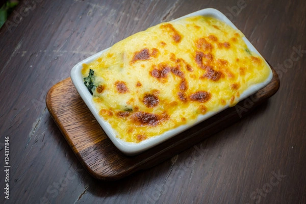 Fototapeta Lasagna on table wood