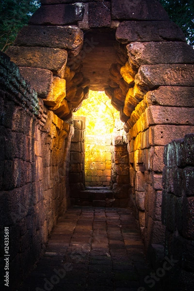 Obraz tunnel  golden light in rock castle ancient