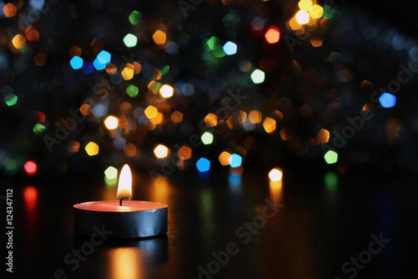 Obraz new year candle on blurred background