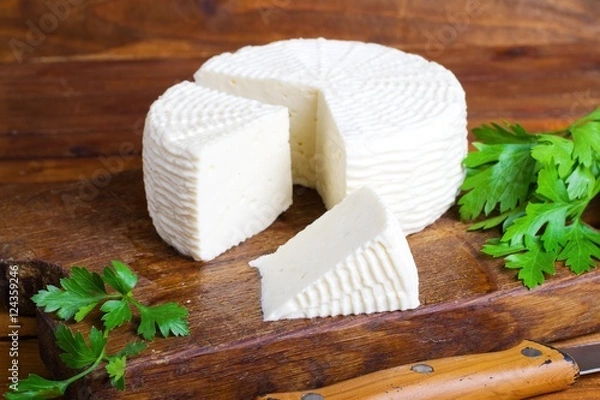 Obraz Soft salty cheese on a wooden table