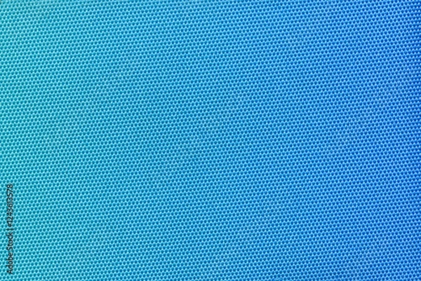 Obraz A vibrant blue fabric with a tight honeycomb pattern, creating a modern and clean texture. Ideal for use in fashion, interior design, or as a versatile background element. Blue gradient.