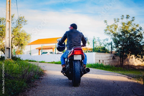 Fototapeta man on a retro motorcycle