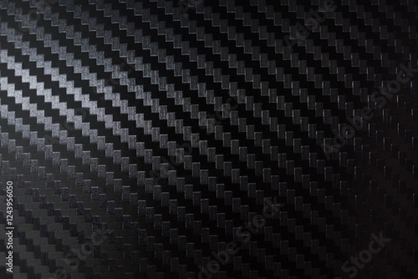 Obraz Carbon fiber composite raw material background. Carbon fiber texture. Dark Gray background with lighting.