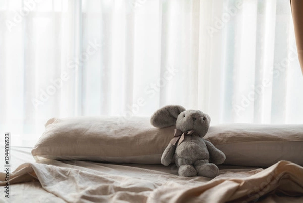 Obraz Gray Rabbit Plush Toy on a Cozy Bed by the Window