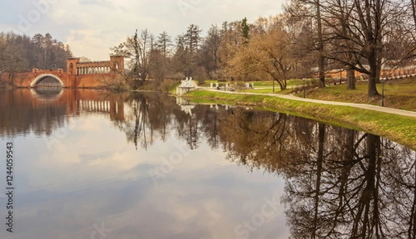 Fototapeta Pond with bridge ruins in spring park