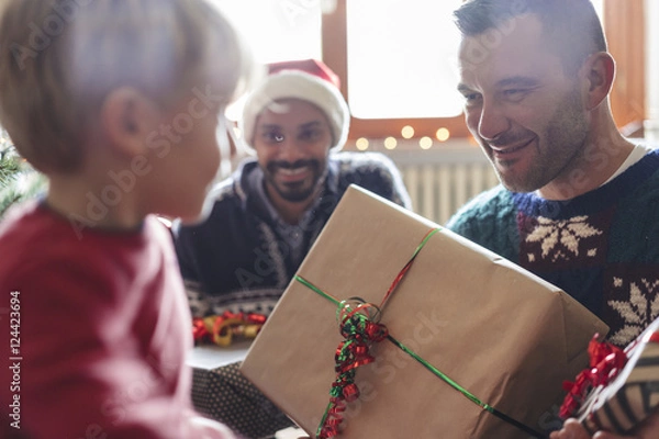 Obraz family at home sharing presents for christmas