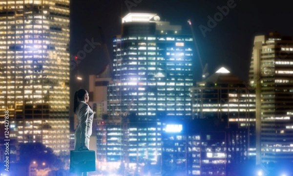 Fototapeta Woman looking at night city