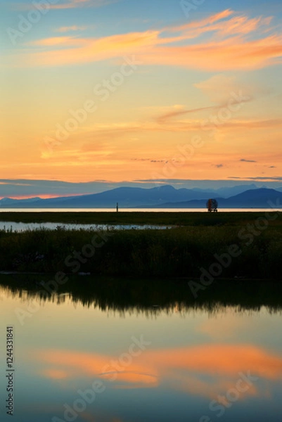 Obraz Salish Sea West Dyke Sunset. Sunset clouds over the Garry Point marshes on the edge of the Salish Sea. Richmond, British Columbia, Canada near Vancouver.

