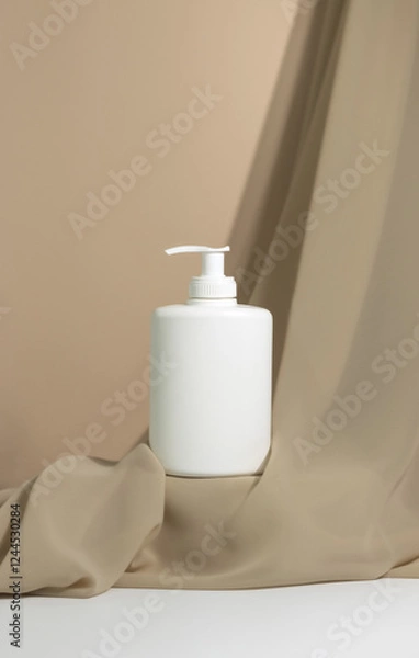 Fototapeta GeneratedWhite pump dispenser bottle on platform. Minimalist Modern Style product photography. Isolated Bottle of body cream with delicate fabric. Advertising Photography. Online shopping.
Minim Image
