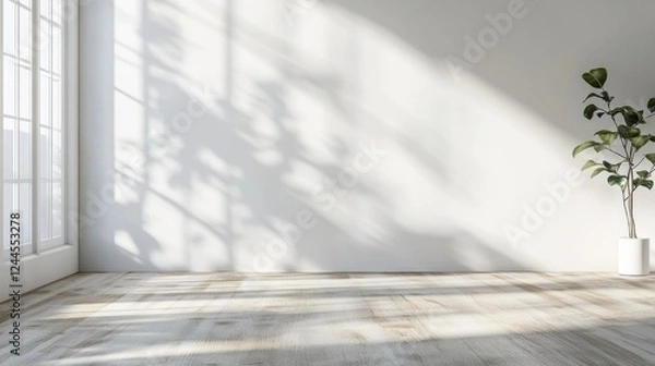 Obraz This is a serene and modern image of an empty living room bathed in natural sunlight. The room features light-colored wooden flooring, white walls, and a minimalist aesthetic with a few carefully