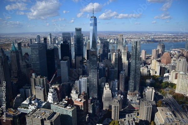 Obraz Aerial view of Manhattan’s skyline with skyscrapers, rivers, and streets. Urban landscape, New York City, cityscape, architecture, aerial photography, metropolis, travel, modern city, iconic view