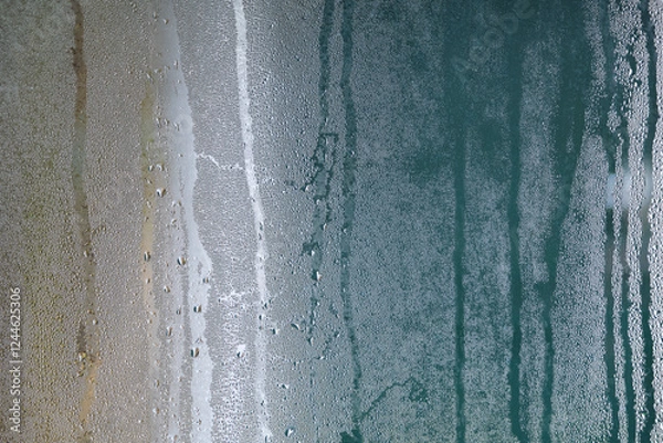 Fototapeta Green and brown background texture of dripping water droplets on a fogged window