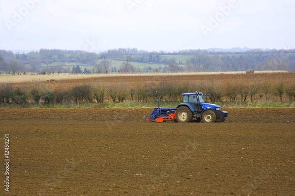 Fototapeta Tractor In fields