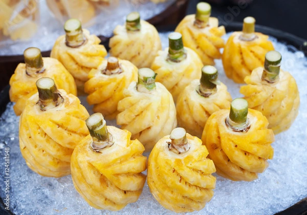 Obraz Pineapple fruit on ice in the market