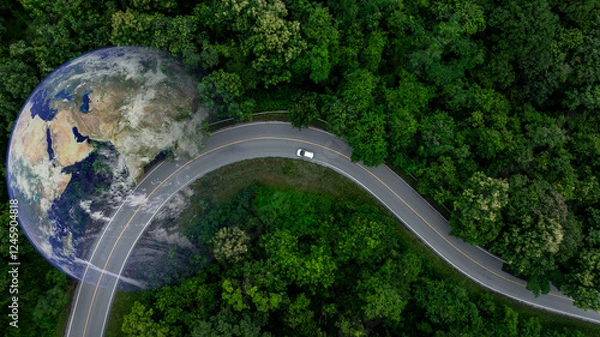 Obraz Aerial view EV electric vehicle car on middle green tree forest road globe earth planet, EV car electric vehicle car alternative sustainable energy eco power, Green business ecosystem environment.