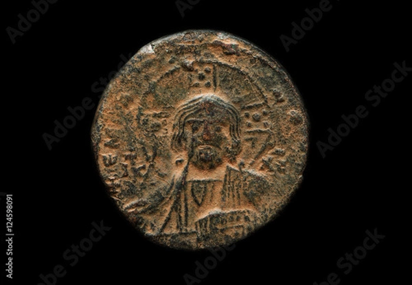 Fototapeta Ancient copper coin with saint portrait on it