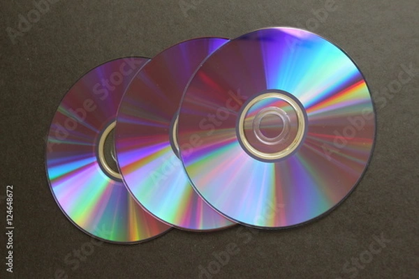 Fototapeta compact discs on a dark background