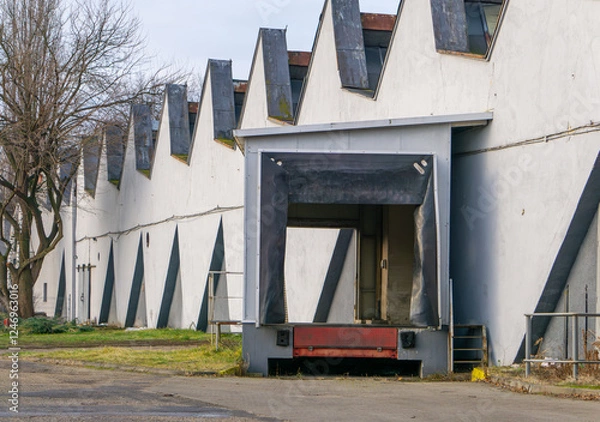 Fototapeta a ramp for unloading goods from trucks in an old abandoned production plant