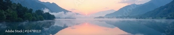 Fototapeta A soft layer of mist envelops the serene mountain lake at dawn, serene, peaceful