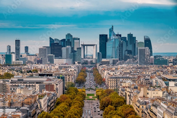 Fototapeta La Defense Financial District Paris France in autumn. Traffic on Champs-Elysees with orange and yellow trees aside. Modern vs. Old architecture. Blue sky