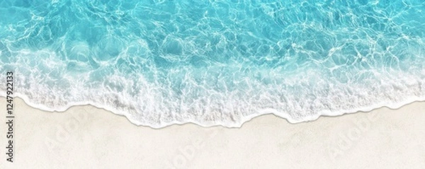 Fototapeta A serene beach scene showcasing gentle waves lapping at a sandy shore, with vibrant turquoise water blending into the light sand.
