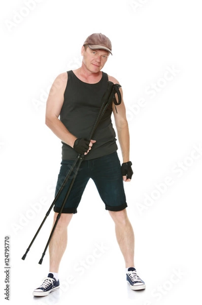 Fototapeta The man is engaged in Nordic walking