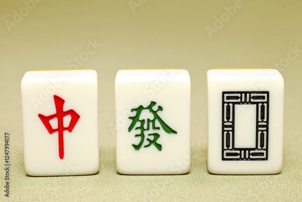 Fototapeta Chinese mahjong tiles, close-up of mahjong tiles on green background  