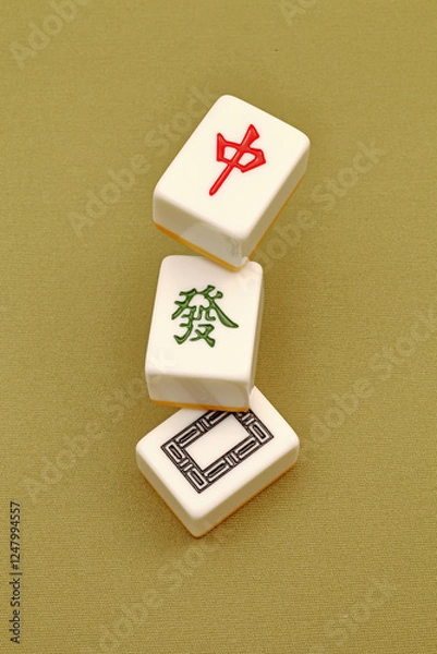 Fototapeta Chinese mahjong tiles, close-up of mahjong tiles on green background  