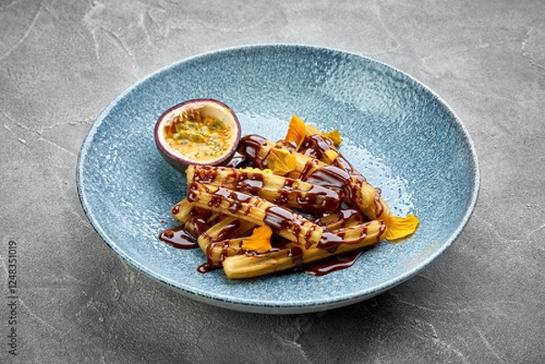 Fototapeta A vibrant and appetizing plate of churros, topped with a rich chocolate sauce and fresh fruit.