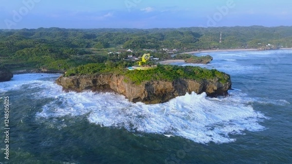 Obraz Aerial Drone view of the beach with white sand, coral rocks, hills with trees, waves from the ocean which is a tourist destination known as Krakal Beach Gunung Kidul Yogyakarta