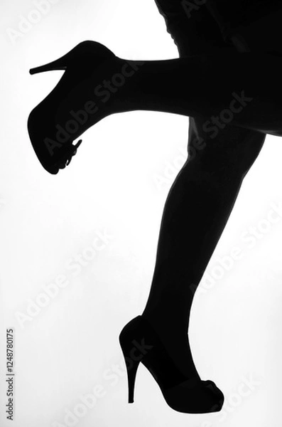 Obraz Woman's legs in high heels silhouette black on white isolated
