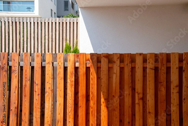 Fototapeta Treated Pine Wood Fence, wooden lumber fencing, architecture close up