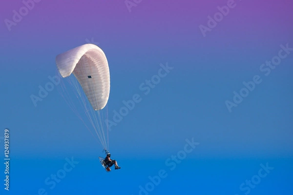 Obraz Paramotor in a blue sky