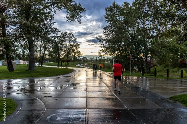 Fototapeta Runners in Calgary after rainfall