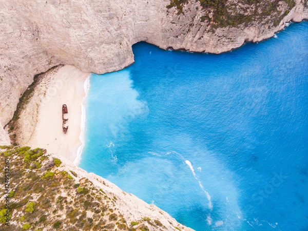 Obraz Navagio bay with shipwreck popular tourist attraction in beautiful turquoise Ionian sea on Zakynthos island, drone aerial view