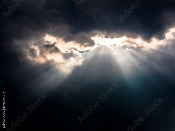 Obraz Sun Rays through Dark Clouds