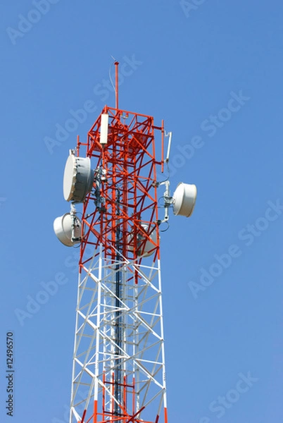 Fototapeta The top of an red white telecommunication tower
