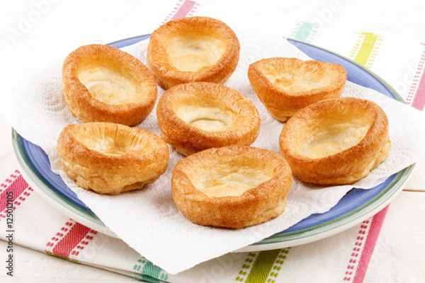 Obraz yorkshire pudding with white paper on a plate