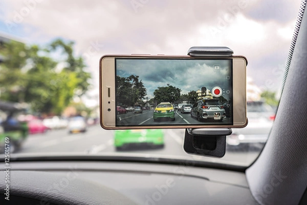 Fototapeta Driving with mobile phone recording