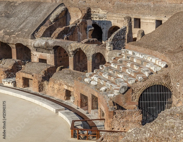 Fototapeta The Colosseum, an architectural monument in Rome, the fragment recovered seats