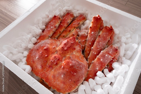 Fototapeta 高級シーフードの王様！発泡スチロールに梱包された冷凍タラバガニ。贈答用やお歳暮、お中元に最適な豪華な海の幸。新鮮なカニの甘みを家庭で楽しめる絶品グルメ。冬の味覚として鍋や焼きガニ、カニしゃぶにもおすすめ！