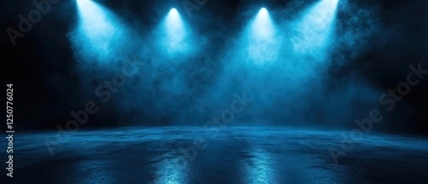 Fototapeta Blue-lit stage with fog creating a dramatic atmosphere for performances