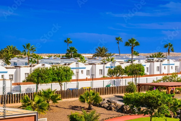 Obraz Apartments in Corralejo with faint silhouettes of volcanoes in the background