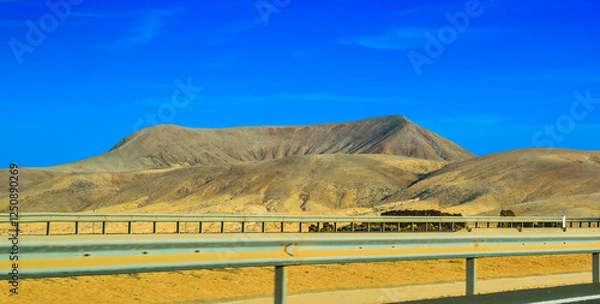 Obraz Extinct volcanoes in Fuerteventura as seen from a car