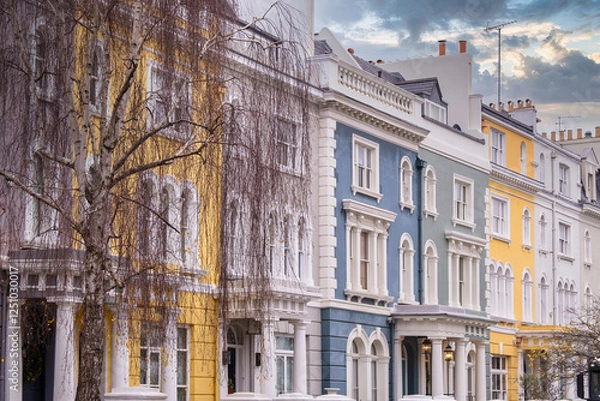 Fototapeta Elegant Colorful Townhouses in Notting Hill, London: Iconic British Architecture with Pastel Facades, Arched Windows, and Classic Details on a Charming Street