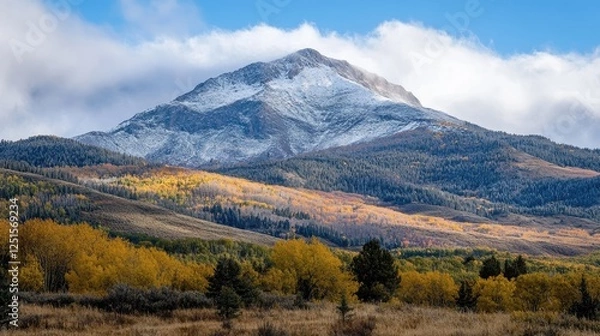 Obraz A photo of a mountain peak, the first signs of snow dusting its slopes as the winter season approaches.